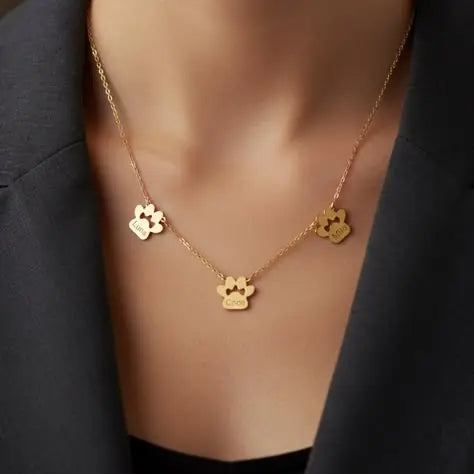 Multi-pet paw necklace charm engraving close-up — personalized stainless steel pet jewelry