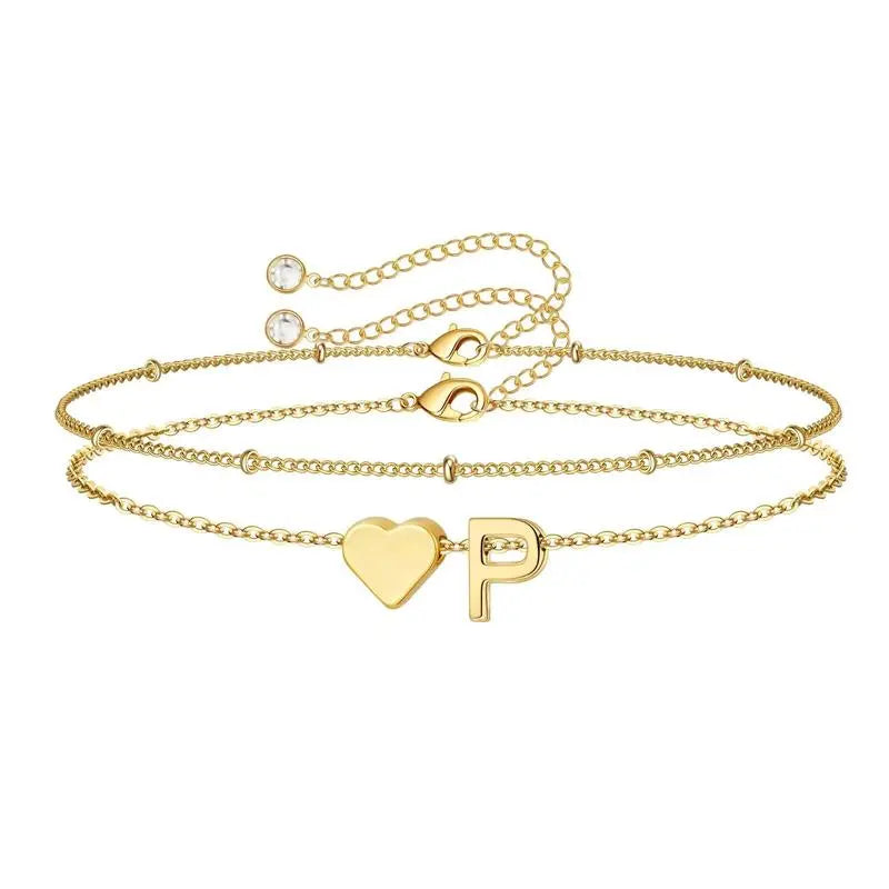 Heart initial bracelet detail shot — dainty hypoallergenic stainless steel jewelry