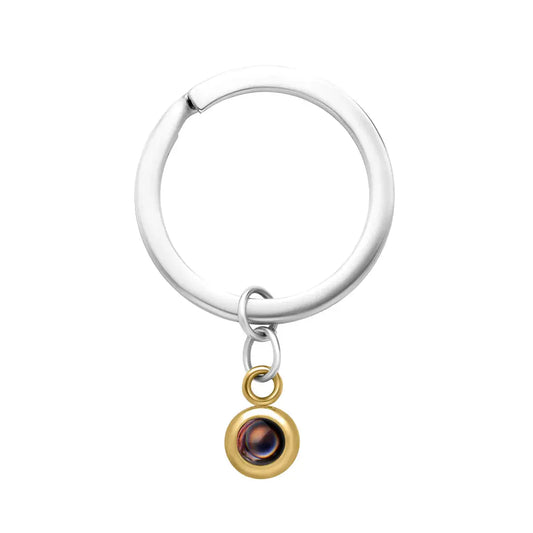 Photo projection keychain in gold — handmade memorial keepsake with hidden personal image