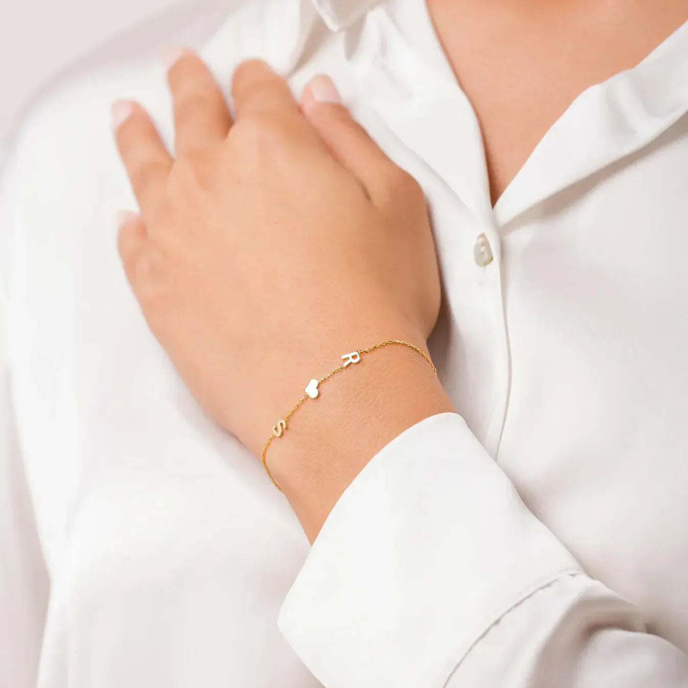 Layered sideways initial bracelet stack — minimalist monogram for everyday styling