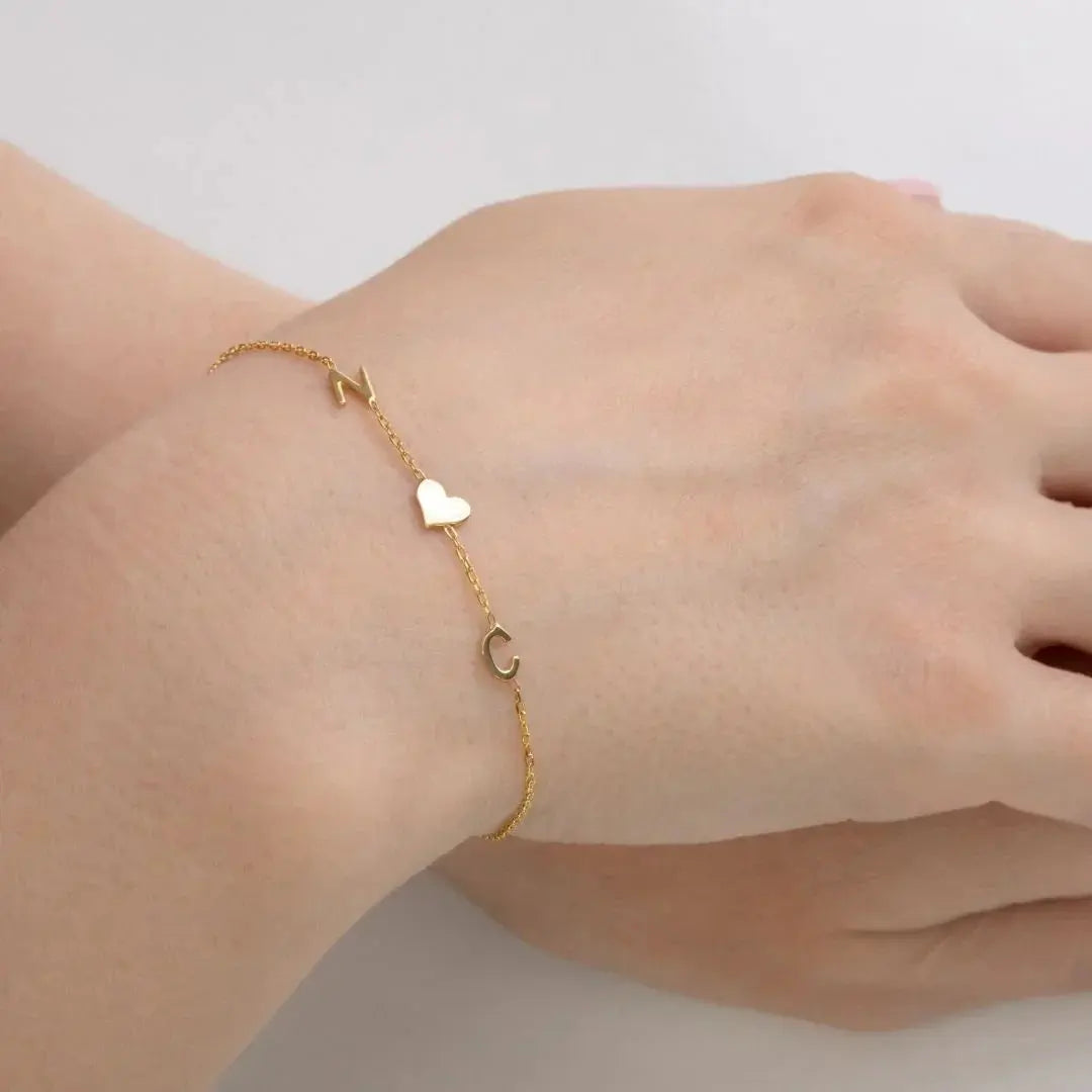 Sideways initial bracelet in 14K gold — handmade personalized jewelry with engraved letter