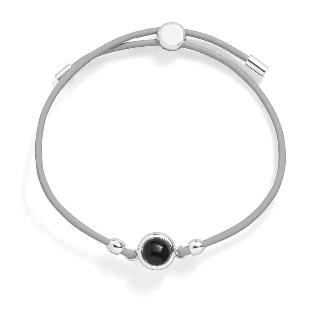 Custom leather photo bracelet in grey with silver clasp — minimalist hidden photo keepsake