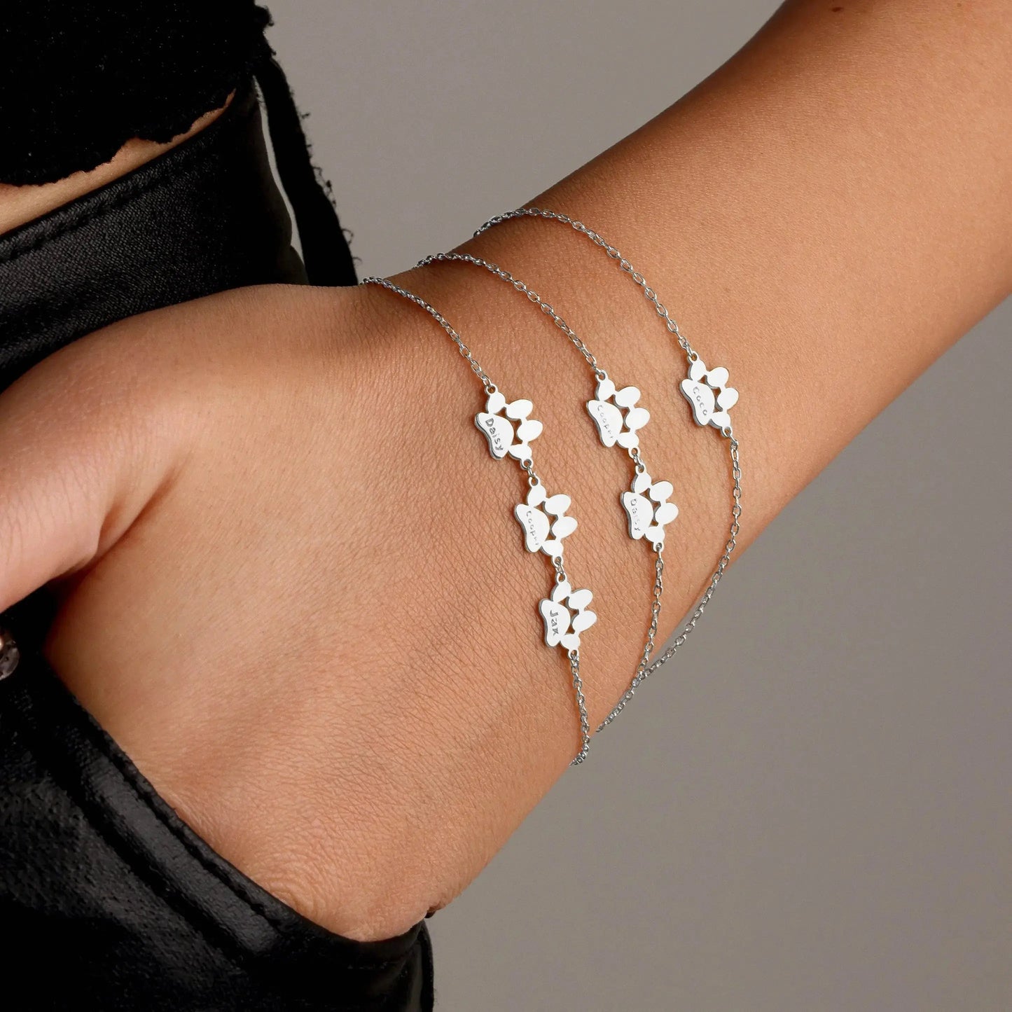 Custom paw bracelet on minimalist wrist — pet memorial keepsake for lost dog or cat