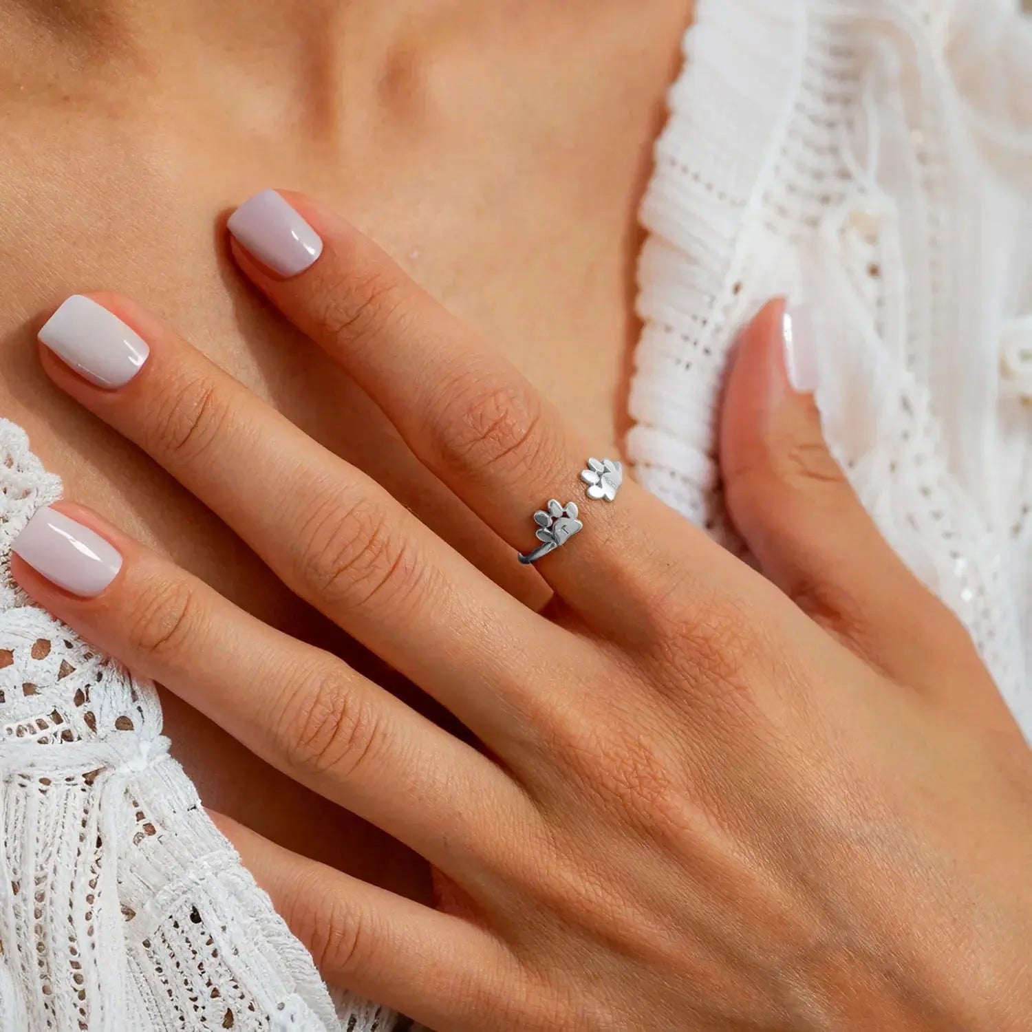 Pet initial ring lifestyle shot on hand — minimalist daily-wear personalized pet jewelry