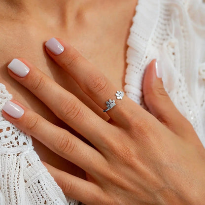 Pet initial ring lifestyle shot on hand — minimalist daily-wear personalized pet jewelry