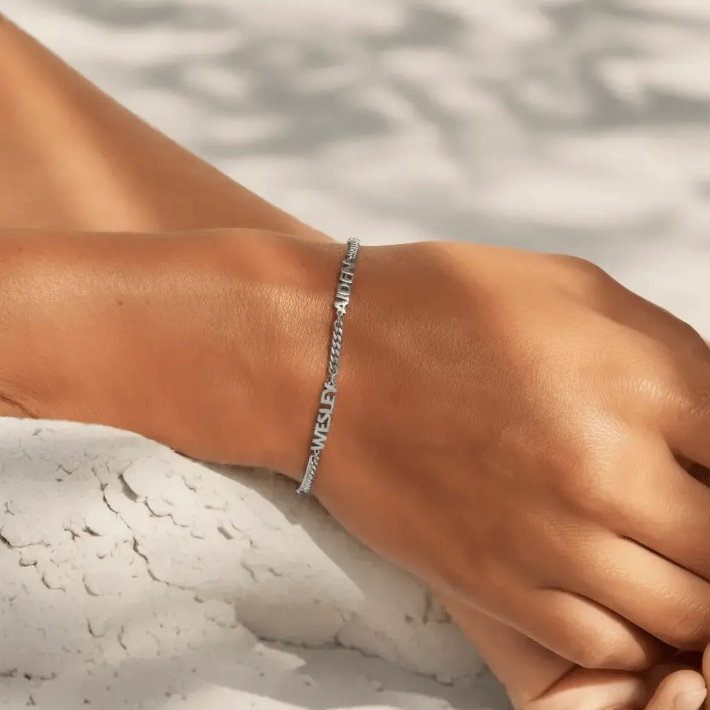 Custom name bracelet in silver — minimalist family-name jewelry for daily wear