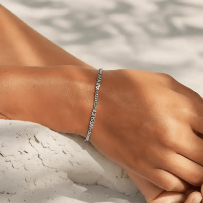 Custom name bracelet in silver — minimalist family-name jewelry for daily wear