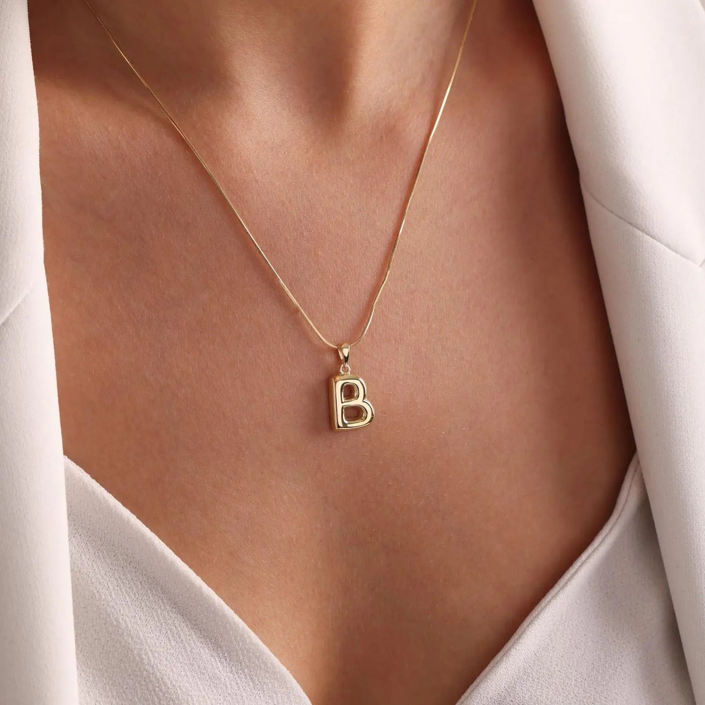 Custom bubble letter necklace beside Y2K accessories — retro-revival personalized gift jewelry