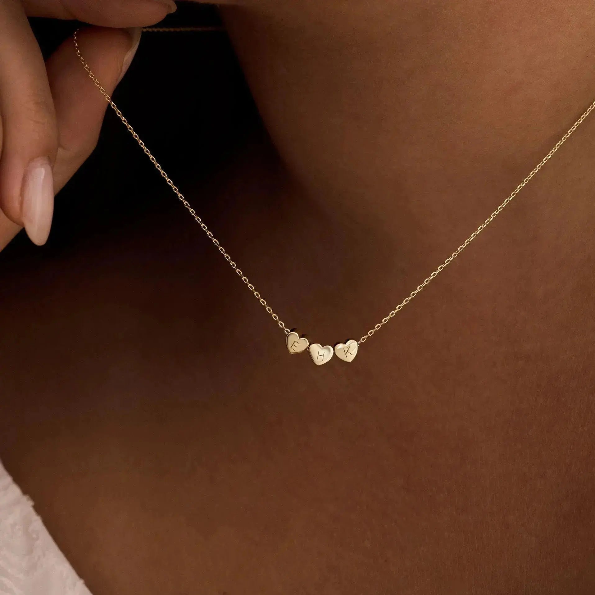 Heart initial necklace styled with casual outfit — minimalist romantic jewelry for daily wear