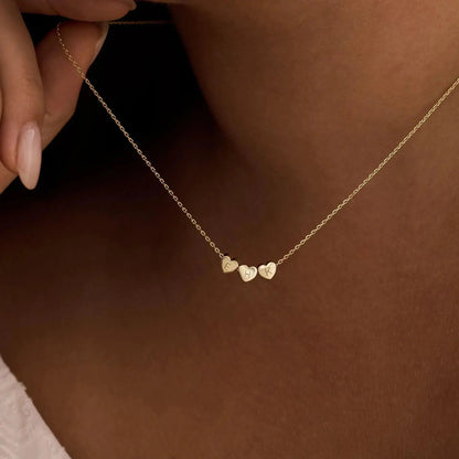 Heart initial necklace styled with casual outfit — minimalist romantic jewelry for daily wear