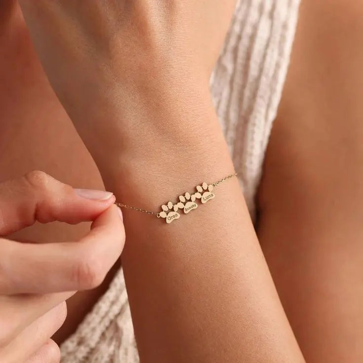 Custom paw bracelet worn with watch and rings — handmade jewelry for dog and cat parents