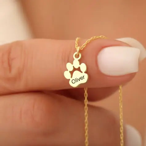 Custom paw name necklace on woman's neck — minimalist pet keepsake for dog and cat parents