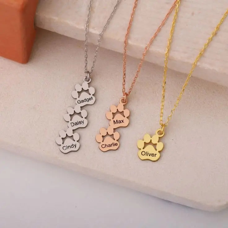 Personalized paw necklace styled with casual outfit — hypoallergenic stainless steel jewelry
