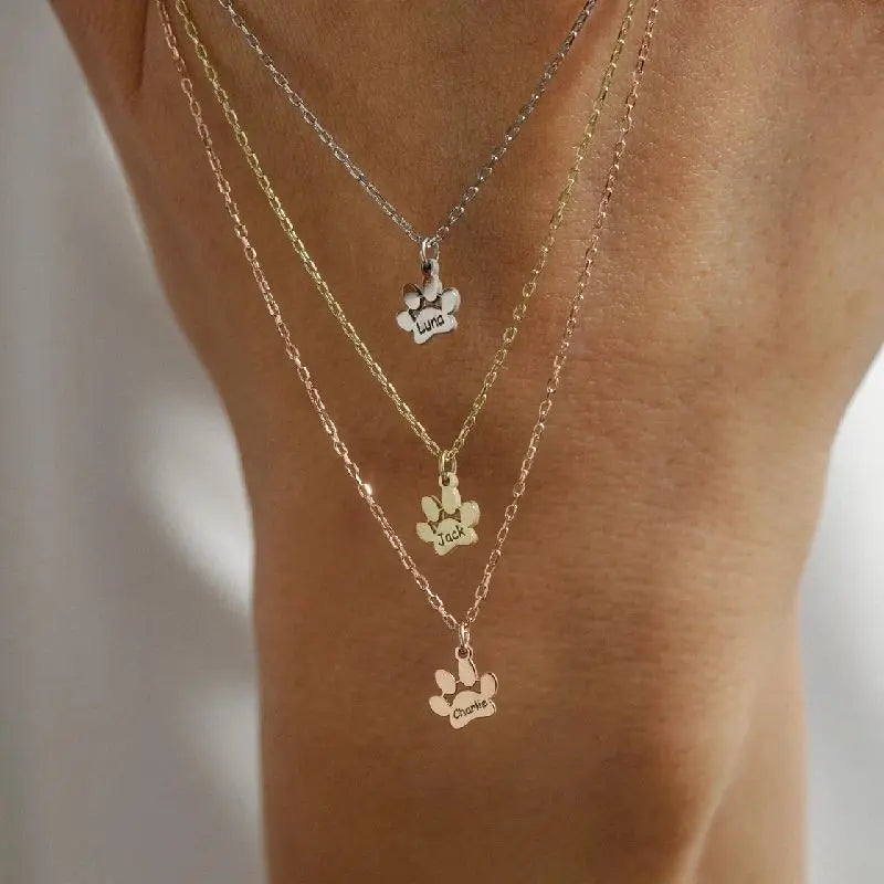 Two custom paw necklaces in gold and silver — matching set for couple or best friend pet parents
