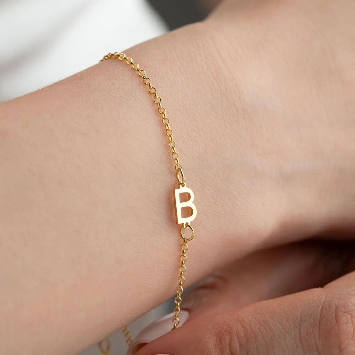 Multiple sideways initial bracelets stacked — personalized matching set for friends or family