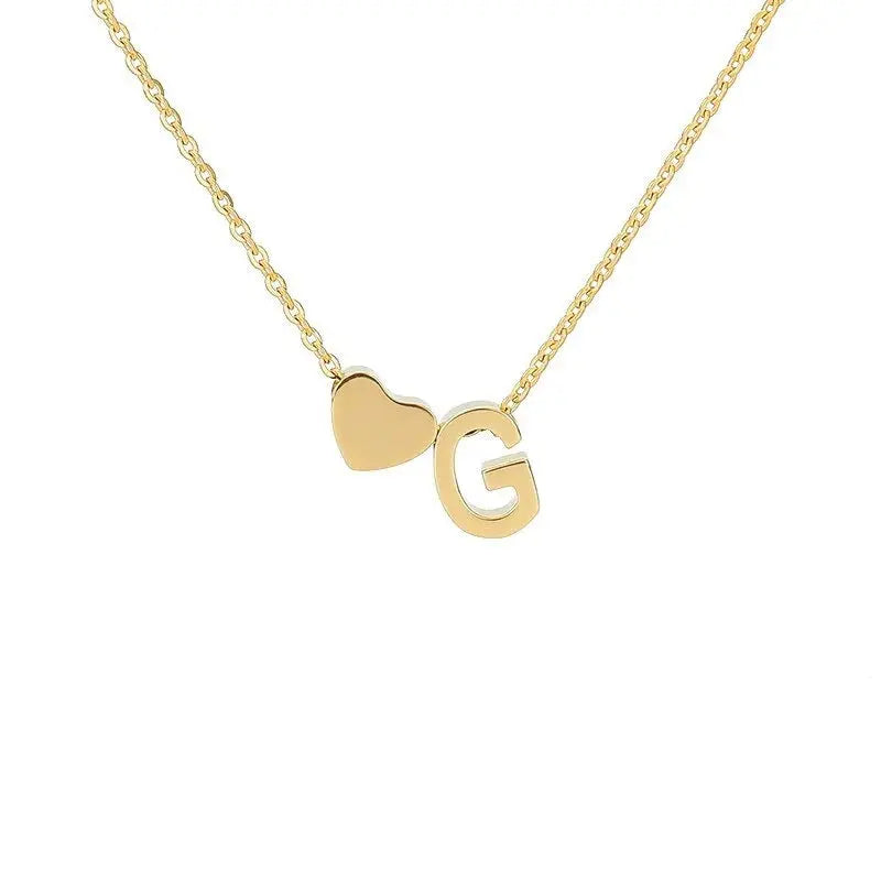 Layered heart initial necklace styling — dainty stackable romantic personalized accessory