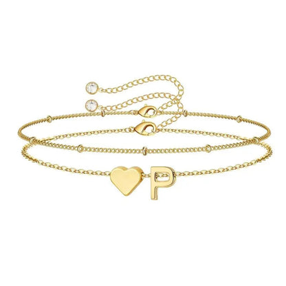 Heart initial bracelet detail shot — dainty hypoallergenic stainless steel jewelry