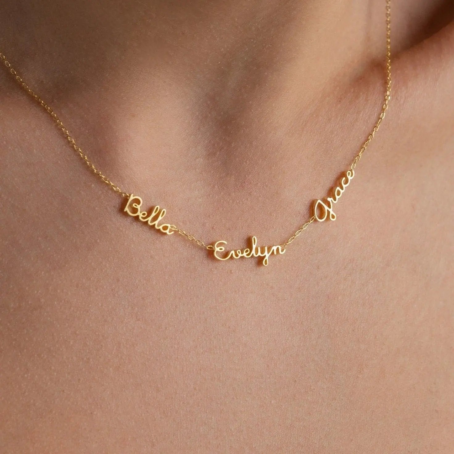 Dainty multiple name necklace with three names in delicate cursive — personalized family keepsake