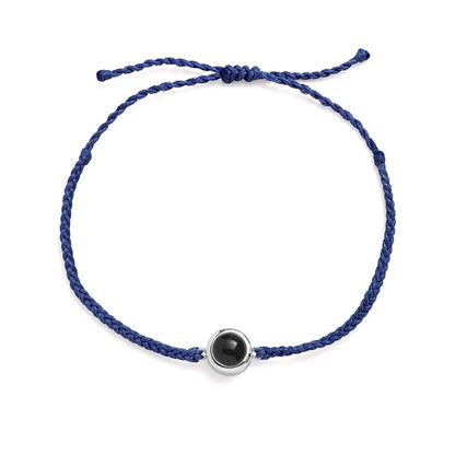Personalized photo bracelet in navy blue leather with silver clasp — classic gift for him
