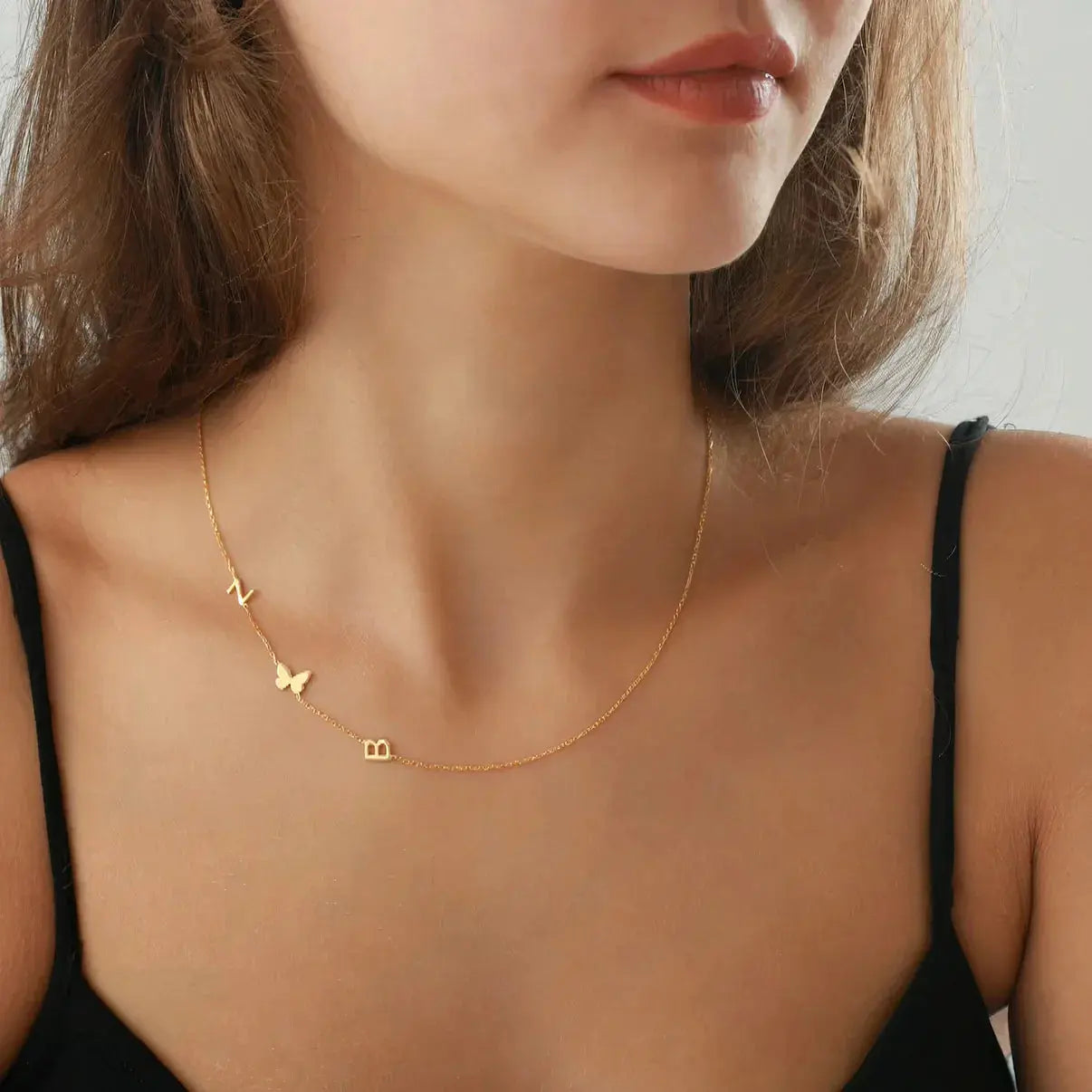 Sideways initial pendant detail — handmade stainless steel hypoallergenic and tarnish-resistant
